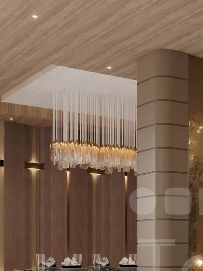 A detail of a crystal chandelier over a dining area, showcasing timeless design.