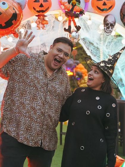 The parents deserve to have fun too. We capture the joy of the hosts and their guests, like this happy couple enjoying the Halloween party they threw for their son.