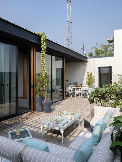 A workplace should also provide moments of respite. This lush terrace garden at a Delhi office serves as a green oasis for employees and a space for social gatherings, reflecting our commitment to designing human-centric environments.