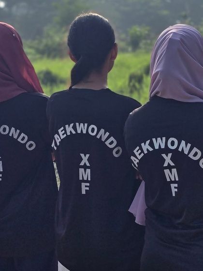 United as a team. Our female students proudly wear the XMF Taekwondo shirt, representing a community of strong, like-minded individuals.