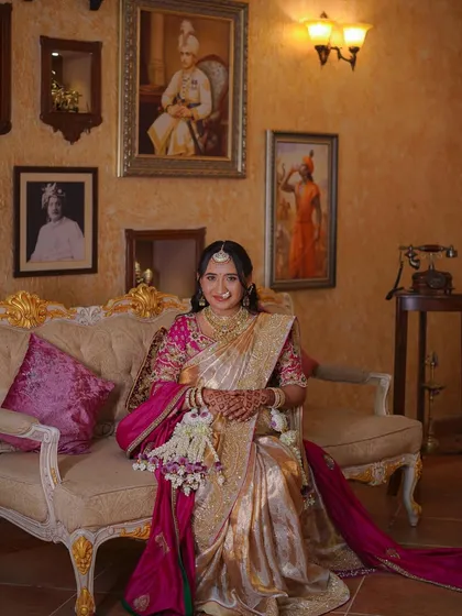 A beautiful portrait capturing the joy of the mother-to-be in a regal setting.
