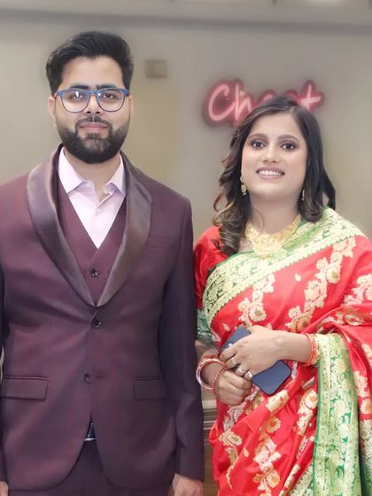 A formally dressed couple posing for a portrait at an event, showcasing my ability to capture sharp, elegant photos.