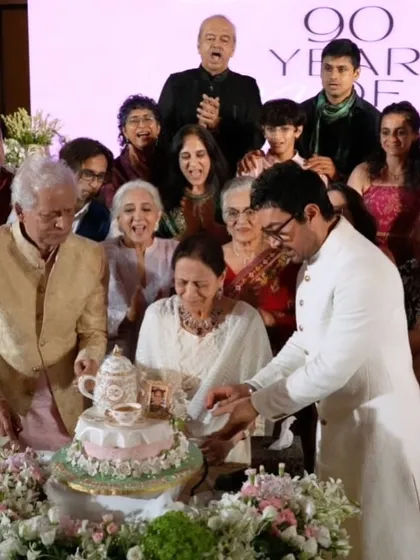 Aamir Khan celebrating his mother's 90th birthday as she prepares to cut her bespoke teapot cake. It's moments like these, filled with family and love, that I cherish being a part of.