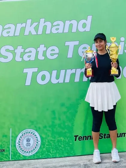 Double victory! Ayesha Ahmed from Ranchi celebrating her Singles and Mixed Doubles titles at the Jharkhand State Tennis Tournament.