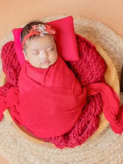 A beautiful way to announce the birth date, with the baby sleeping peacefully in a bowl prop.