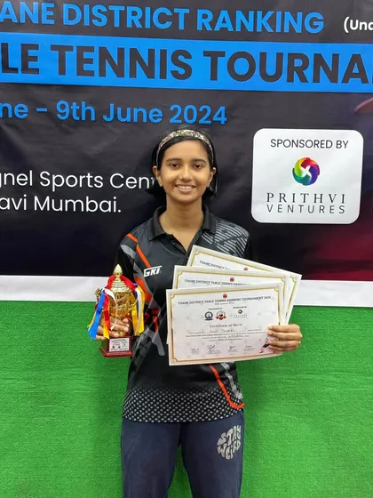 Anvi Thorat holds her certificates after earning three bronze medals in the U-15, U-19, and Women's categories at the 1st District Ranking Tournament.