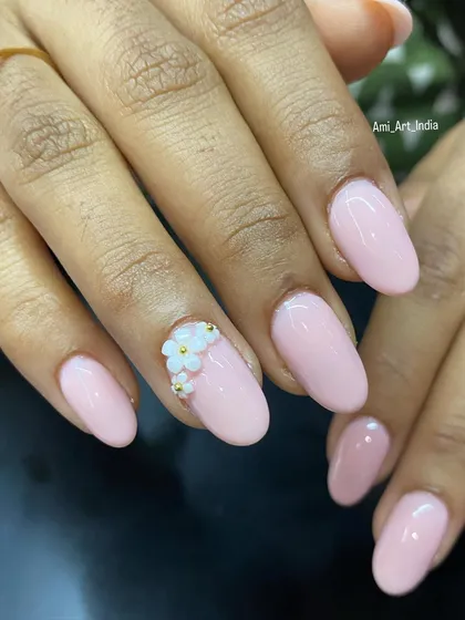 Another angle of the delicate 3D flower accent on a soft pink base.