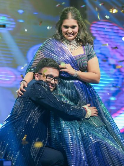 "Client turns family." A happy hug with our choreographer after a successful sangeet night. This is why we love what we do.