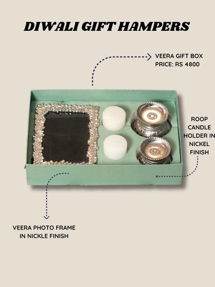 For a touch of silver, the Veera Gift Box pairs a nickel-finish photo frame with matching Roop candle holders, presented in a lovely green box.
