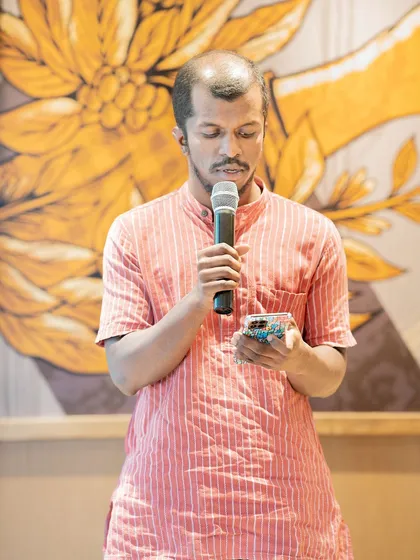 A poet performs at our "Voices of the Nation" themed event. This gathering celebrated India's Independence Day through poetry and stories.