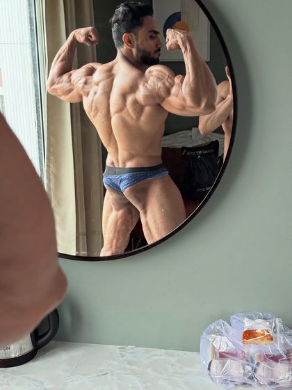 A mirror selfie on show day, checking my back condition. Every detail has to be perfect.