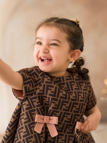 A moment of pure, uninhibited laughter. This candid shot captures the joyful spirit of childhood perfectly.