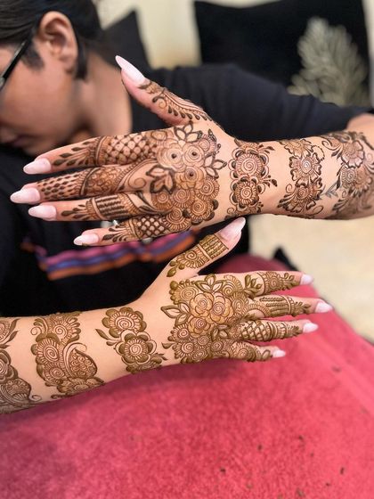 A beautiful floral design that covers both hands and arms. This is a great option for a bride who loves flowers.