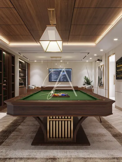 A modern take on a classic billiard room. We combined rich wood textures on the pool table and ceiling with contemporary furniture and lighting to create a sophisticated yet comfortable entertainment space for a commercial establishment.
