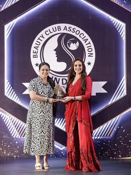 Feeling honored to receive an award from the Beauty Club Association, a recognition of my dedication and artistry.