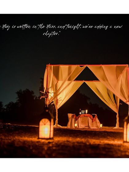 We can set up a dream-like candlelight dinner for your pre-wedding shoot. This image captures the beautiful, romantic ambiance of a private dinner setting under the stars.