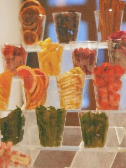 A creative and healthy bar setup for a daytime event. We displayed a variety of fresh, dehydrated fruits and herbs for guests to customize their drinks.