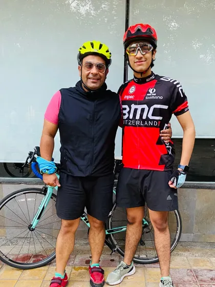 A proud father with his son, who is now part of the cycling crew. We love seeing the passion for cycling passed down through generations.