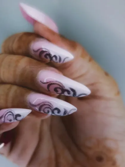 A side view of the edgy stiletto nails, showing the sharp shape.