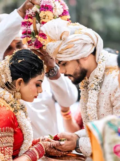 An intimate close-up from a South Indian wedding, capturing the reverence of the ceremony. Our photographers are experienced in various cultural traditions, ensuring we respectfully document the most important details of your day.