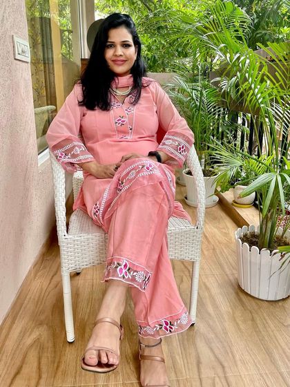 This pink suit with white embroidery is a lovely piece from a homegrown brand. The color is so fresh and the design is very elegant.