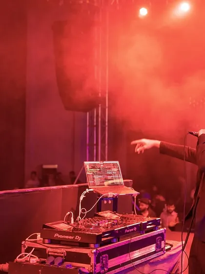 Setting the mood with lights and smoke at a corporate gig. I bring a full professional setup to make any event feel like a major production.