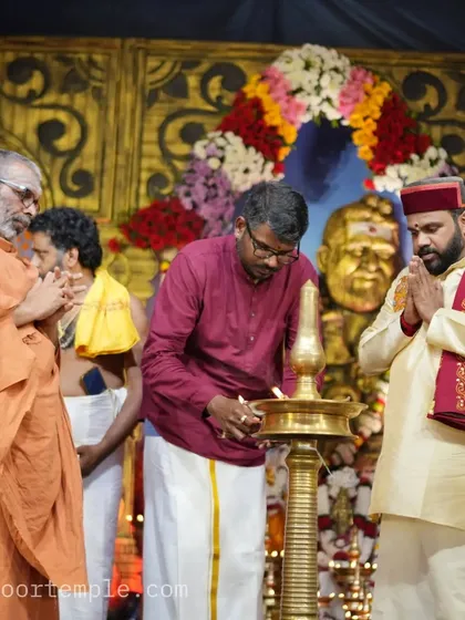 Lighting the lamp to inaugurate the event at Malliyoor Temple. This traditional act symbolizes the dispelling of darkness and the pursuit of knowledge.