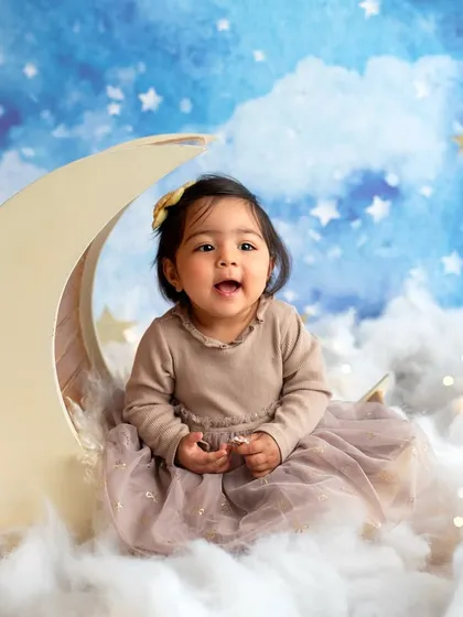 I was over the moon creating this dreamy setup for a sweet sitter session. My studio is filled with props like this to bring your creative ideas to life, making each toddler portrait session a unique adventure.