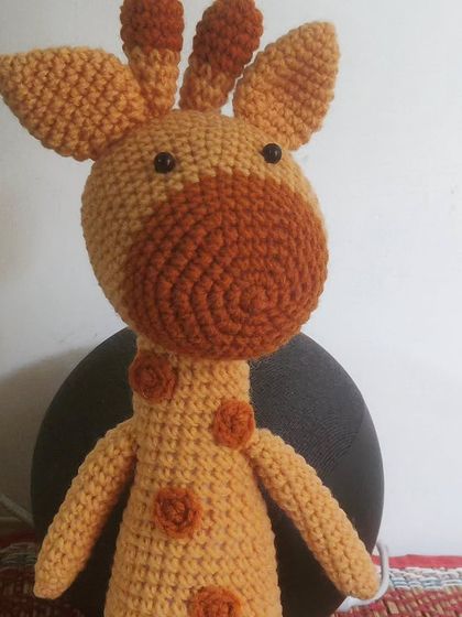 This is Gifu, my smarty-pants giraffe, all ready for Diwali shopping. I love giving my creations little backstories. This amigurumi giraffe is a fun and friendly toy for any animal lover.