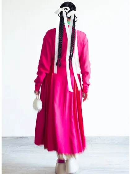 The back view of my outfit for the Bodice show, showing the long braids interwoven with white ribbons.