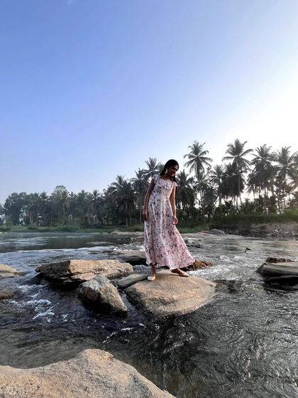 Carefully navigating the rocks in the flowing river. Being physically in nature, feeling the water and the stones, is a grounding experience.