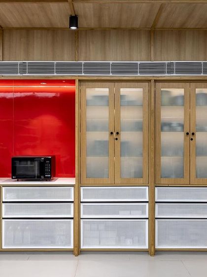 Our well-organized storage and prep areas, featuring modern equipment against our signature red accent wall.