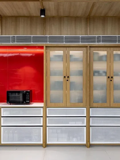 Our well-organized storage and prep areas, featuring modern equipment against our signature red accent wall.