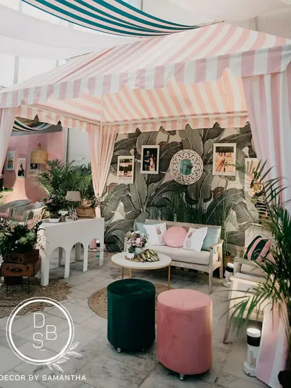 I love bringing a unique theme to life, like this "Hotel California" retro brunch. We recreated the iconic Beverly Hills Hotel cabana, using Martinique wallpaper, custom striped awnings, and personal photos to tell the couple's story with a cool, coastal vibe.
