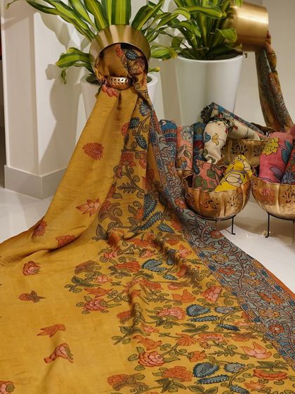 This is a glimpse into my Kalamkari Edition, featuring a wide array of hand-painted dupattas and fabrics from the Indralokam series. Each piece is a unique story, available for you to customize into your dream outfit.