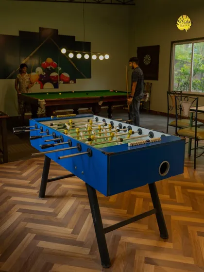 Beyond relaxation, there's always room for fun. Our indoor game zone, featuring foosball and pool, is a great space for friends, family, and corporate teams to connect and unwind.