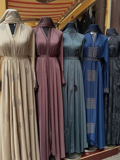 A lineup of beautiful, authentic abayas sourced directly from Dubai. I find a range of styles, from the elegant earth tones you see here to more vibrant colours, ensuring there's a perfect piece for everyone.