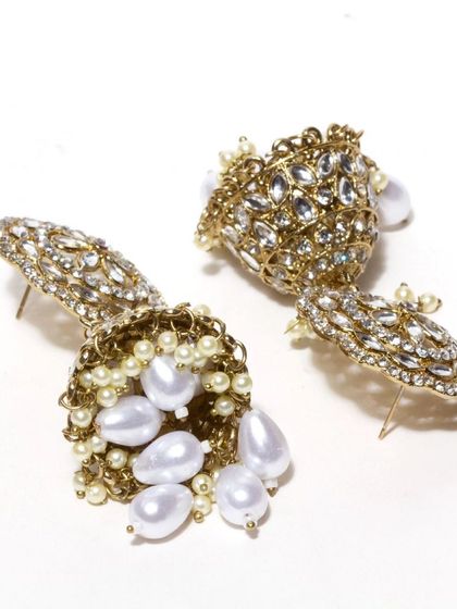 Another view of our beautiful kundan and pearl jhumkas, showing the detailed craftsmanship and the secure post-back closure. These are a timeless addition to any jewellery collection.