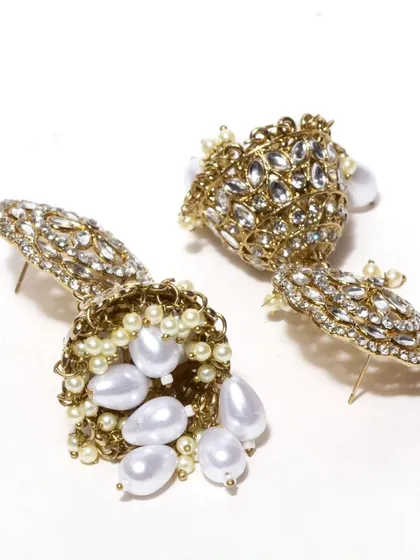 Another view of our beautiful kundan and pearl jhumkas, showing the detailed craftsmanship and the secure post-back closure. These are a timeless addition to any jewellery collection.