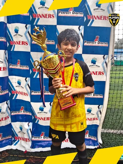 Another one of our U8 champions, beaming with pride. Individual confidence is built through collective success.