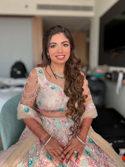 Kejal looking stunning for her reception. We focused on a flawless base, soft pink tones on the eyes and lips, and beautiful long lashes to complete her elegant look.