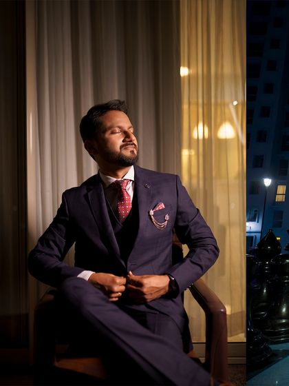 A dapper portrait of the groom in his suit, looking sharp and confident. I make sure the groom's style and personality shine through in his individual photos.