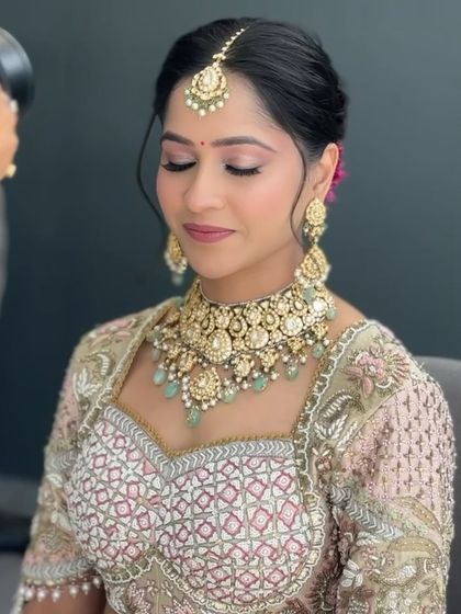 The perfect soft glam for a modern bride. Shrriya's closed-eye pose showcases the beautifully blended eyeshadow and the overall minimalist approach to her wedding day makeup.