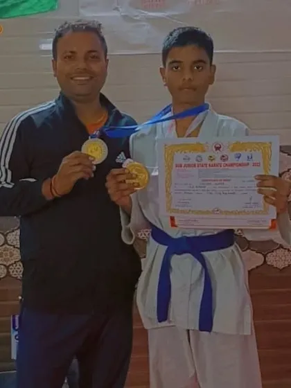 A proud coach with his student Shiva, who won gold at the sub-junior state karate championship.