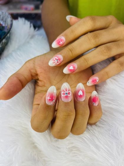 A sweet and playful design perfect for spreading love. This set features a soft pink and white ombre base with hand-painted bows and hearts.