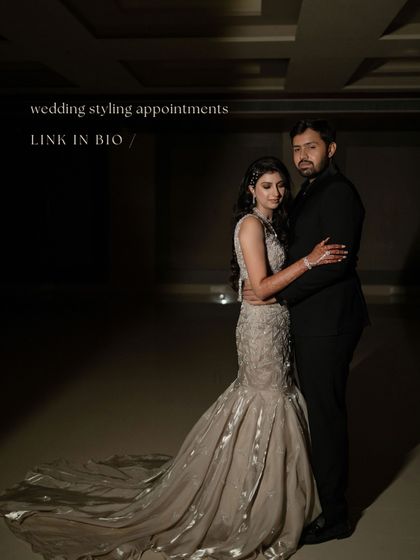A full-length portrait of the couple, their outfits exuding a classic, cinematic feel.