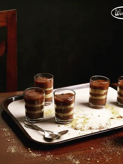 Our chocolate verrines, a layered dessert served in a glass. This elegant treat combines different textures and flavours of chocolate for a delightful experience.