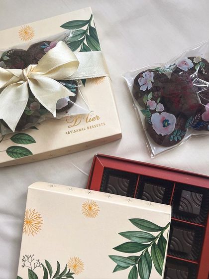 A versatile mini hamper option, featuring a box of truffles and a pack of our floral-printed cookies, suitable for any celebration.