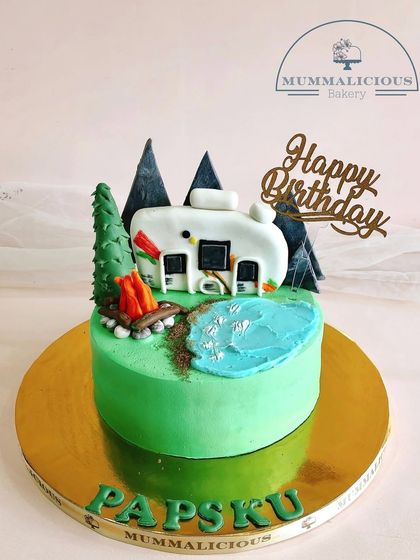 For the little adventurer, we created this camping-themed cake. It features a cozy caravan, a crackling campfire, and a serene pond, bringing the great outdoors to the party table.