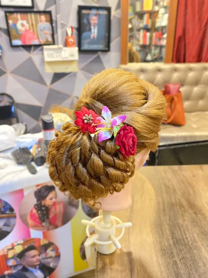 A clear shot of the student's final work. I guide my students to create polished and professional hairstyles that are ready for real clients.